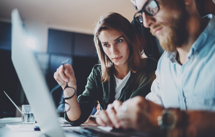 Two accounting professionals discussing a client