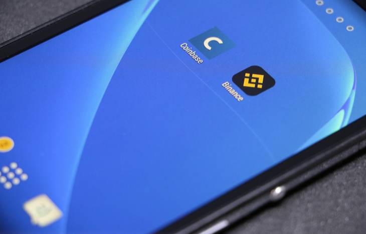 Binance vs. Coinbase apps on a smartphone