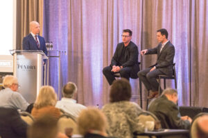 Moderator Nathan Hurd (left) looks on Marc Lichtenfeld (right) explains a point that Bryan Bottarelli (center) definitely doesn’t agree with. 